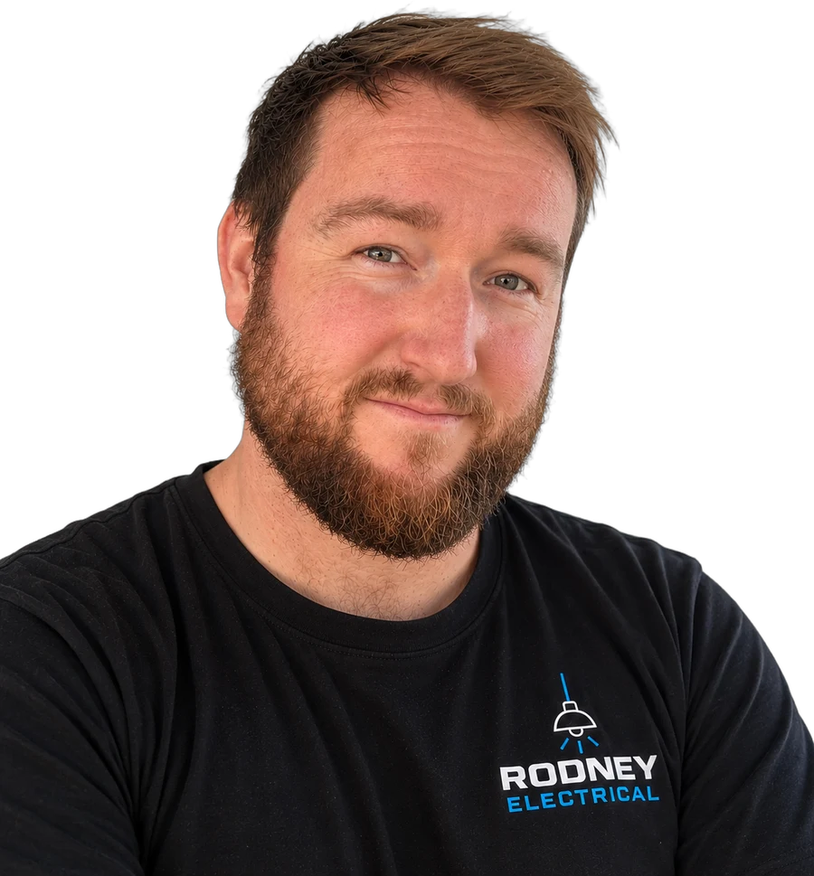 Mike, owner of Rodney Electrical, wearing a Rodney Electrical work tee